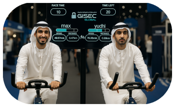 Guests racing on interactive bike game at corporate event in Dubai